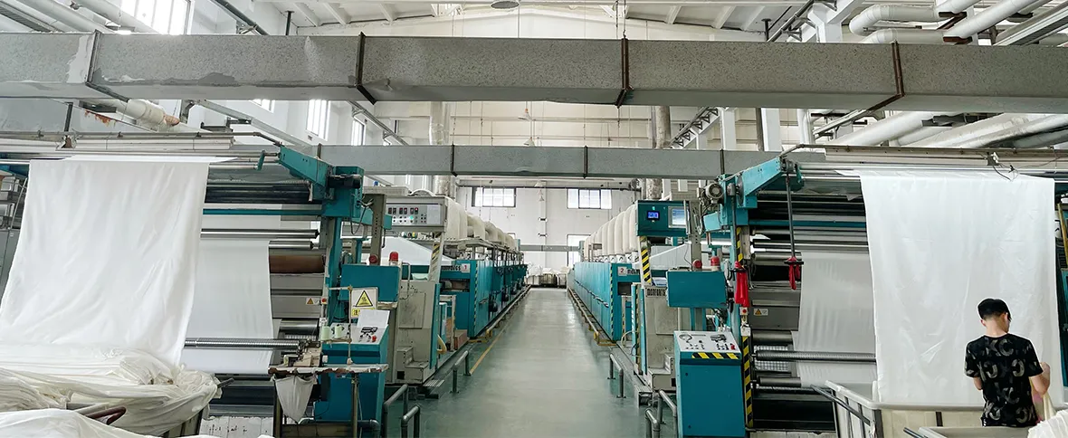 Fabric processing machinery in a textile production facility