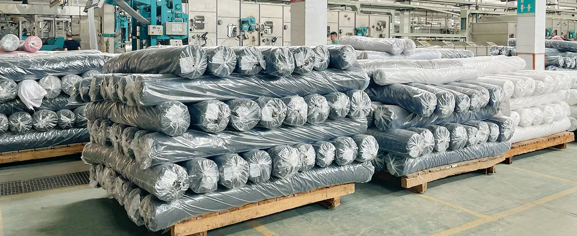 Packaged textile rolls in a fabric production facility